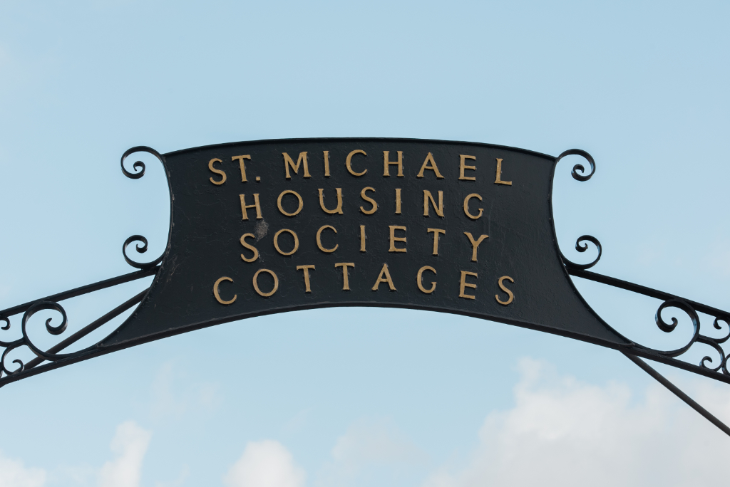 The sign above the enytrance to the St. Michael Housing Society Cottages in Penzance.